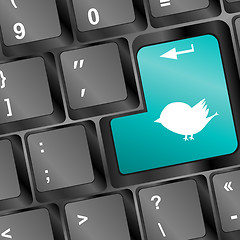 Image showing white bird silhouette on computer pc keyboard