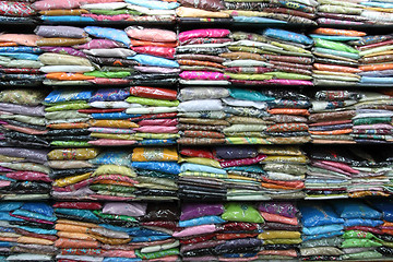 Image showing sari on shelves in indian market