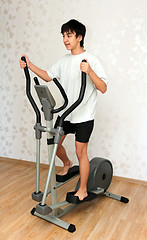 Image showing boy exercising on trainer