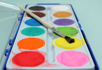 Image showing set of water-colour paints and brush