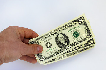 Image showing Hand holding US dollars on a white background