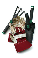 Image showing Used gardening / work gloves and tools