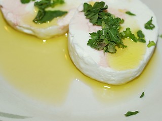 Image showing Tomino cheese with rucola and olive oil