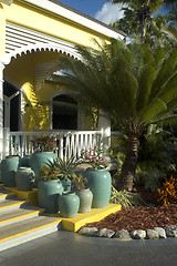 Image showing plants in pots in front of hotel