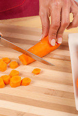 Image showing Chopping carrots