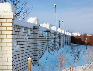 Image showing Brick wall, covered with snow