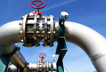 Image showing Industrial zone, Steel pipelines and valves against blue sky