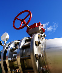 Image showing Industrial zone, Steel pipelines and valves against blue sky