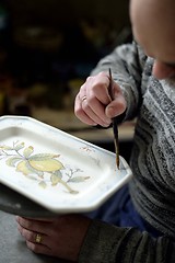 Image showing Hand holding paintbrush