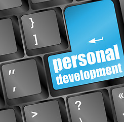 Image showing Keyboard with blue enter button personal development