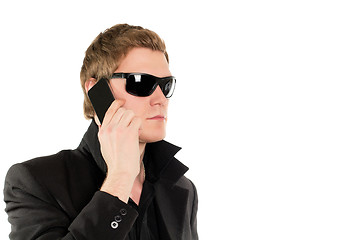 Image showing Man in black with a phone