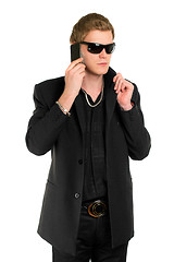 Image showing Young man in sunglasses with a phone