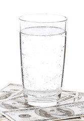 Image showing Dollars and glass of water