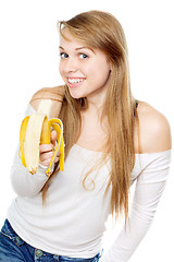 Image showing Playful woman holding banana