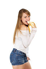 Image showing Woman eating banana