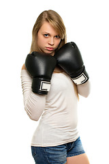 Image showing Young woman posing with boxing gloves