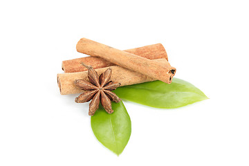 Image showing Star Anise, cinnamon and and green leave on white