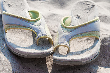 Image showing Flip-flops and sand