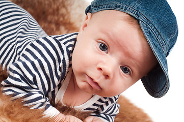 Image showing Newborn baby in denim cap