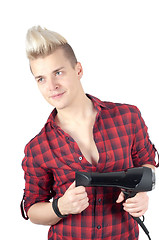 Image showing Portrait of handsome man in red with hairdryer