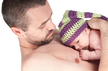 Image showing Newborn baby in knitted hat with dad