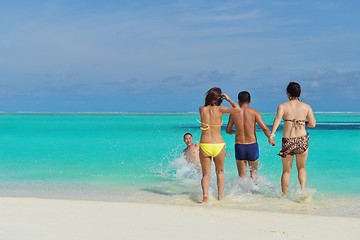 Image showing group of happy young people have fun on bach