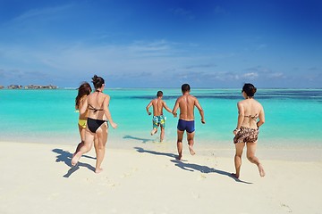 Image showing group of happy young people have fun on bach