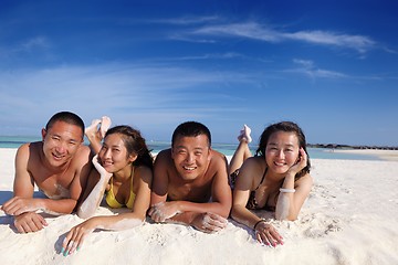 Image showing group of happy young people have fun on bach