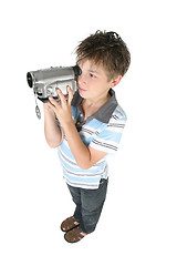 Image showing Standing boy using a digital video camera