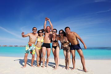 Image showing group of happy young people have fun on bach