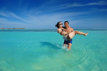 Image showing happy young  couple enjoying summer on beach