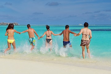 Image showing group of happy young people have fun on bach