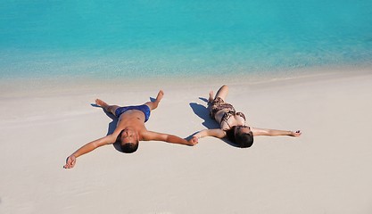 Image showing happy young  couple enjoying summer on beach