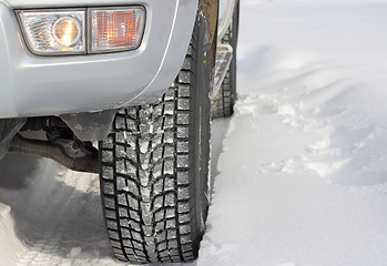 Image showing Snowy winter road ahead an unrecognizable car