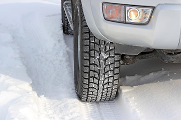 Image showing Snowy winter road ahead an unrecognizable car