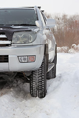 Image showing Snowy winter road ahead an unrecognizable car