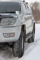 Image showing Snowy winter road ahead an unrecognizable car