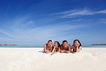 Image showing group of happy young people have fun on bach