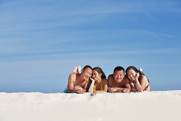 Image showing group of happy young people have fun on bach