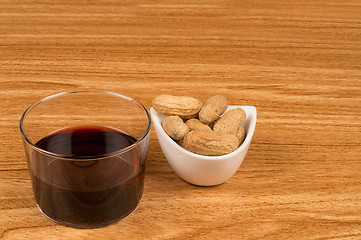 Image showing Wine and peanuts