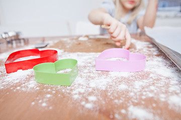 Image showing Young girl making gingerbread