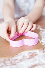 Image showing Young girl making gingerbread