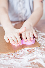 Image showing Young girl making gingerbread