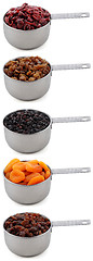 Image showing A variety of dried fruit in cup measures