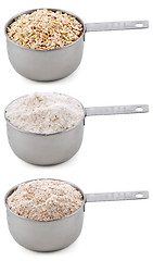 Image showing Everyday staple ingredients - rolled oats and flours - in cup me