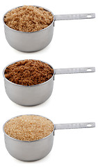 Image showing Three different sugars in cup measures