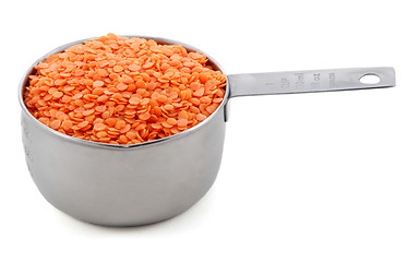 Image showing Red lentils presented in an American metal cup measure
