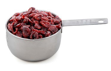 Image showing Dried cranberries presented in an American metal cup measure