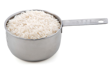 Image showing White long grain rice presented in an American metal cup measure