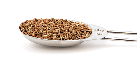 Image showing Cumin seeds measured in a metal tablespoon